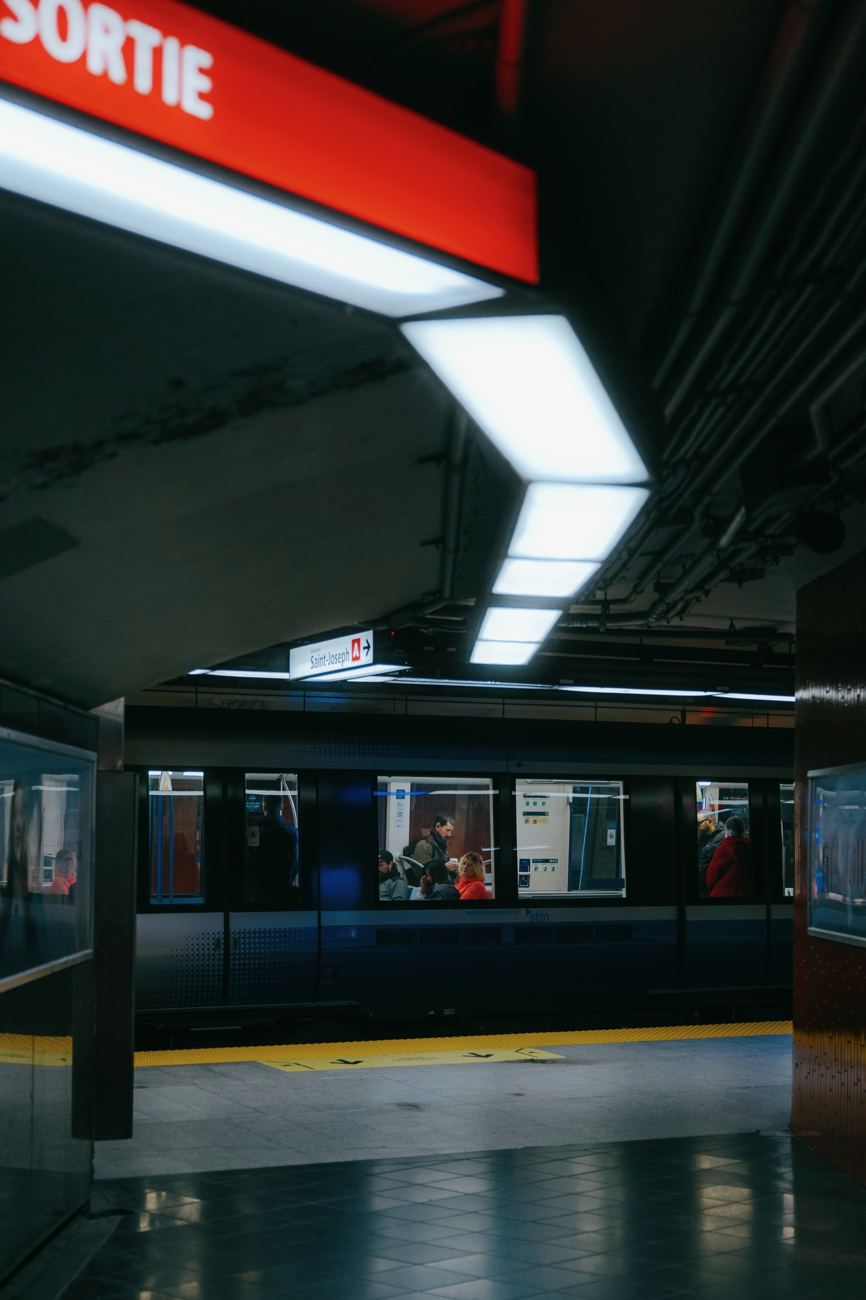 a metro platform under the sortie sign, long-exposure still