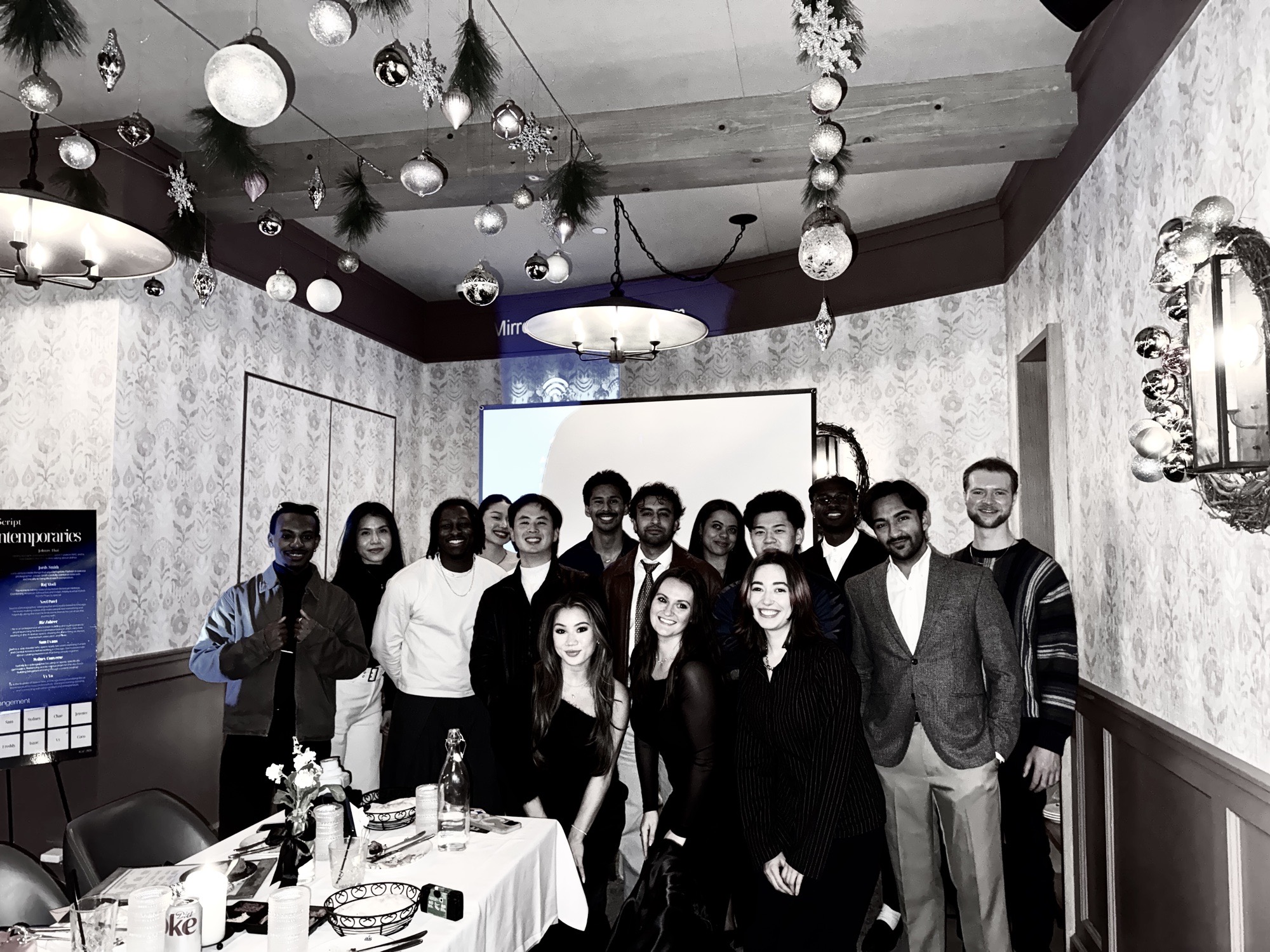 the full cast of take 001 posing together in the private dining room at ambar