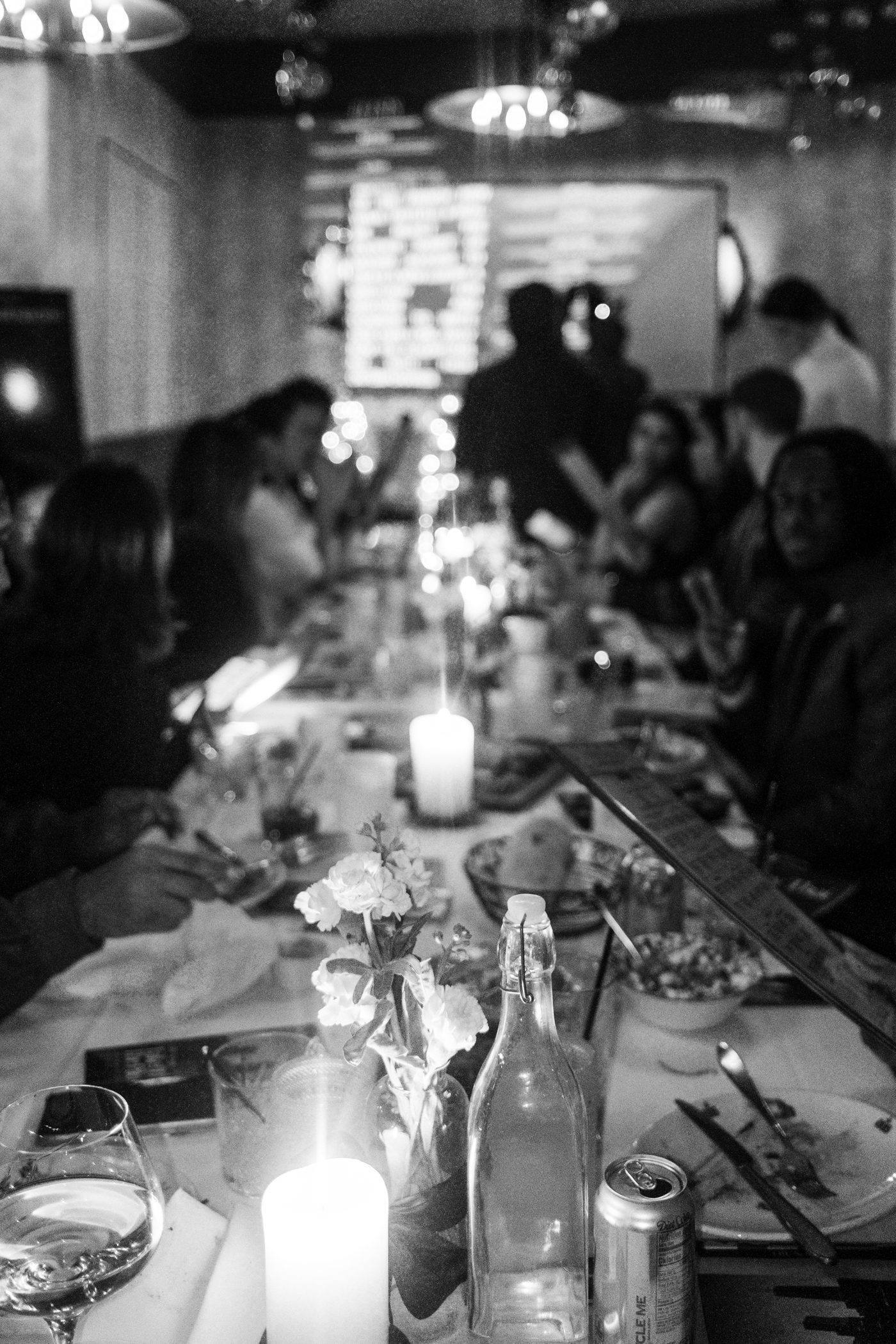 the table by candlelight, flowers and film program in frame