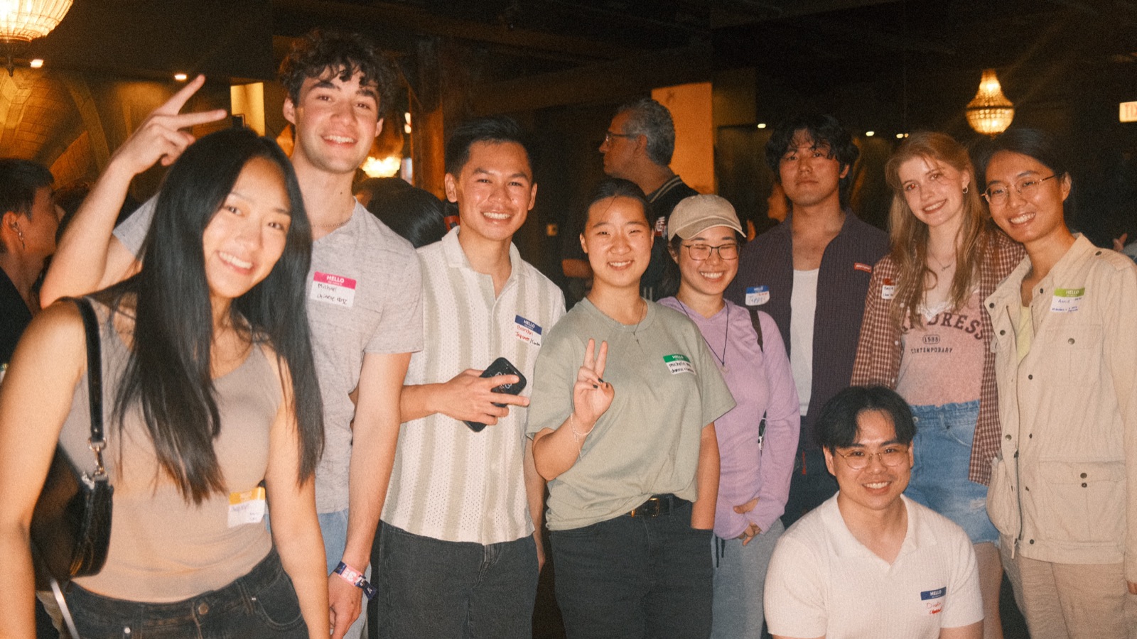 a ten-person cluster throwing peace signs at vol 2