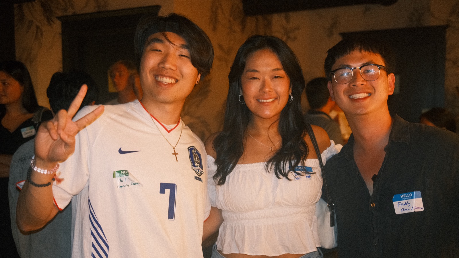 a trio with name tags on and big natural smiles