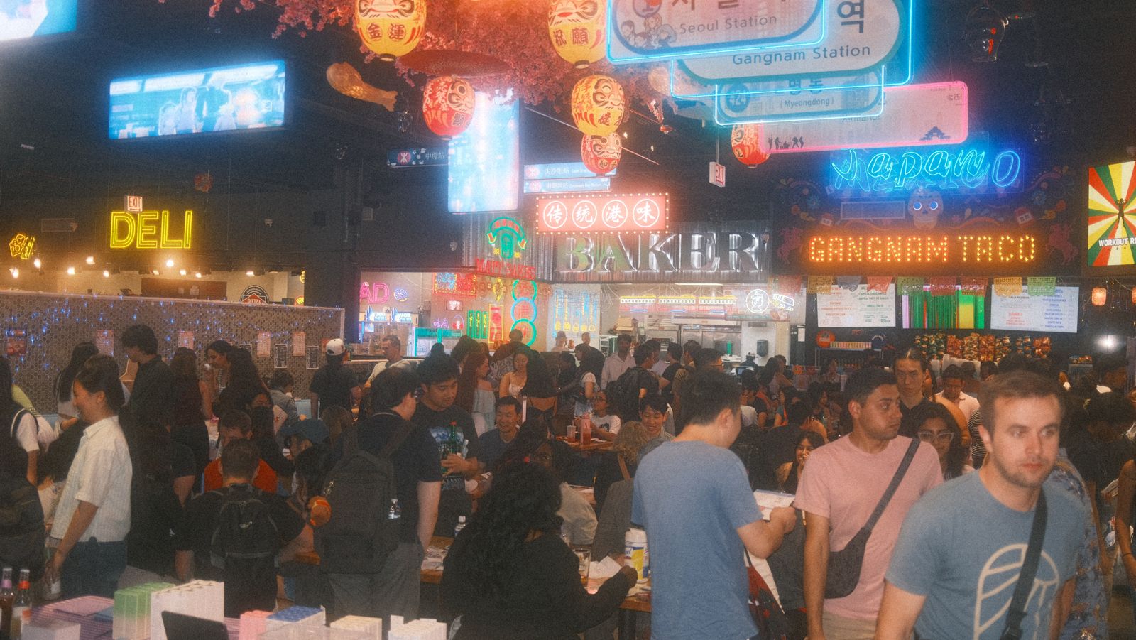 the gangnam market food hall at vol 5: neon signs, lanterns, and a full crowd