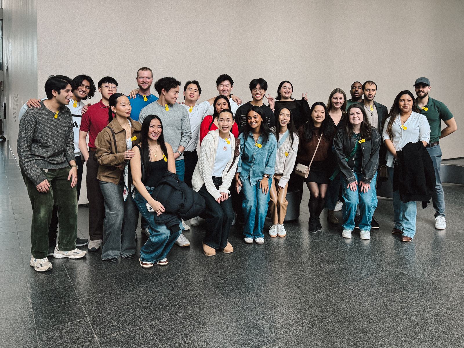 the full crew posing inside a museum hall on the lunch & museum experience
